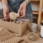 young-female-pitcher-or-owner-of-small-pottery-sho-resize.jpg